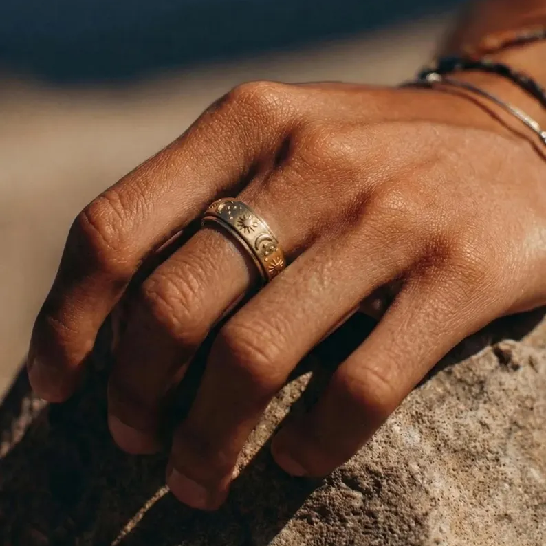 Sun‑Moon‑Star Embossed Rotating Spinner Ring Collection